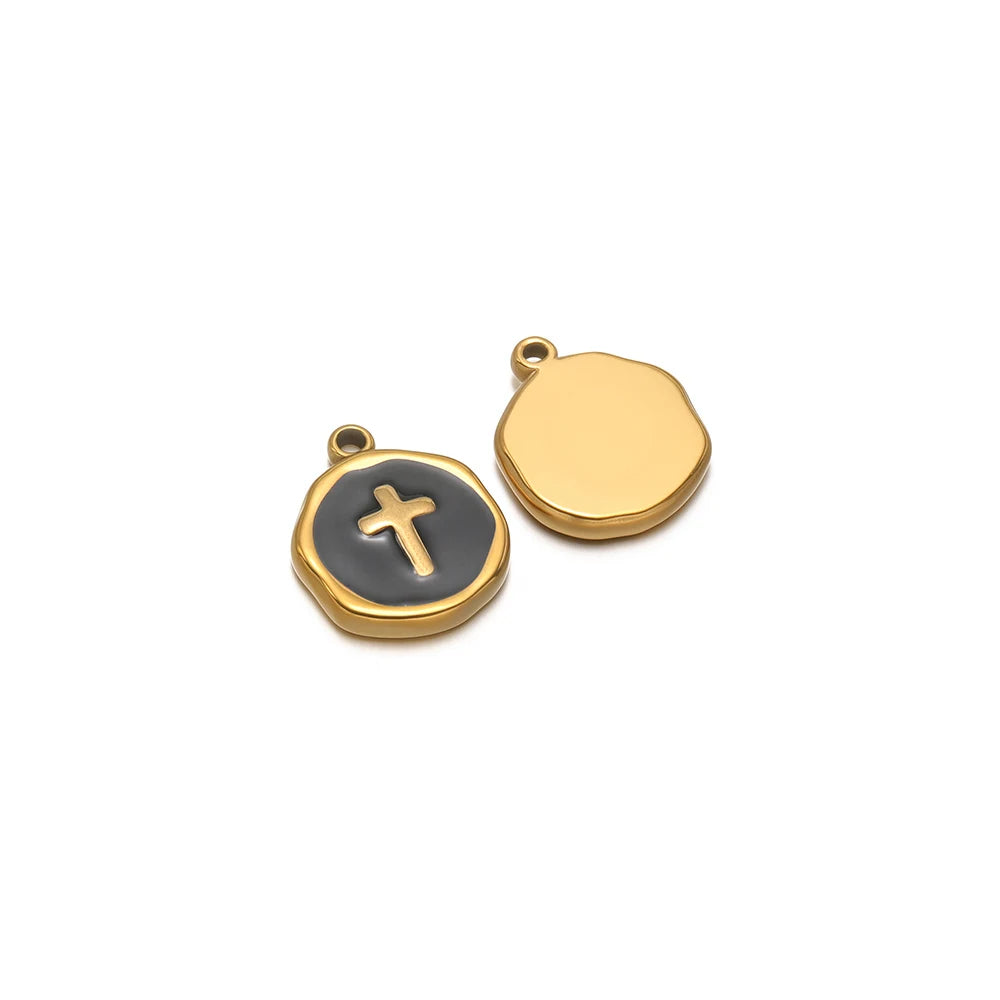 Round enamel charm pendant with gold border, black cross design and plain gold charm