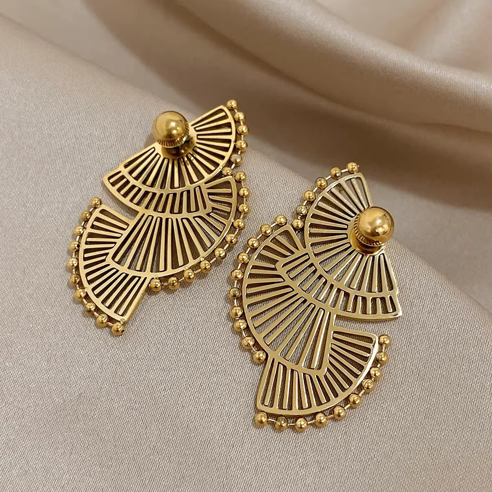 Pair of gold-tone openwork fan earrings with round studs and beaded edges
