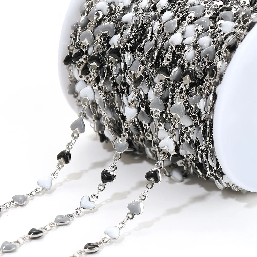 Silver-tone heart link chain with black enamel heart charms and small stainless links