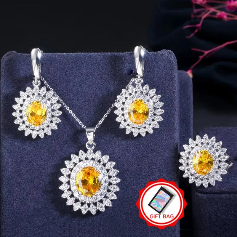 Yellow oval cubic zirconia jewelry set with flower-halo earrings, pendant necklace, and ring