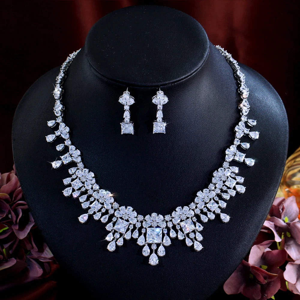 Cubic zirconia bridal necklace with matching drop earrings, silver-tone sparkle.
