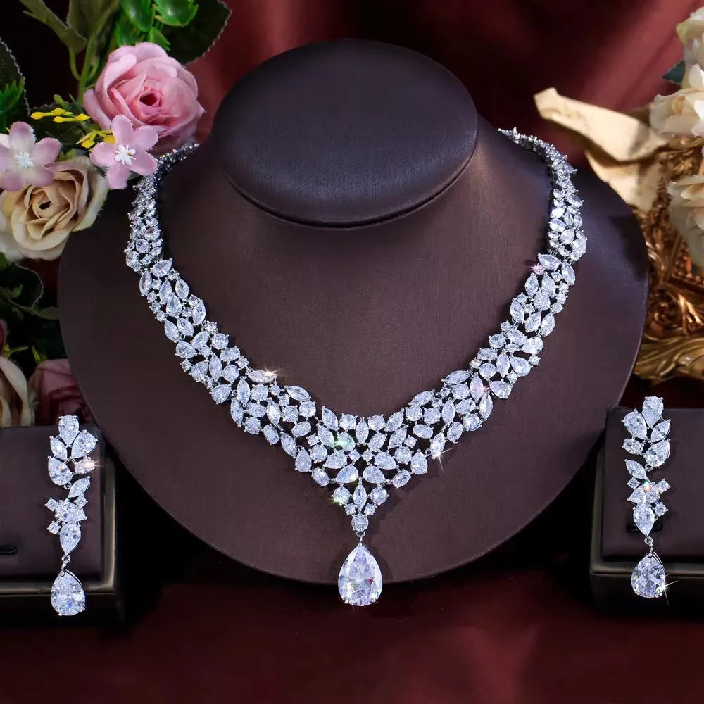 V-shaped floral CZ necklace and matching drop earrings displayed as a set