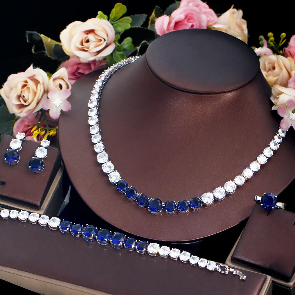 Blue cubic zirconia tennis jewelry set with necklace, bracelet, ring, and matching earrings