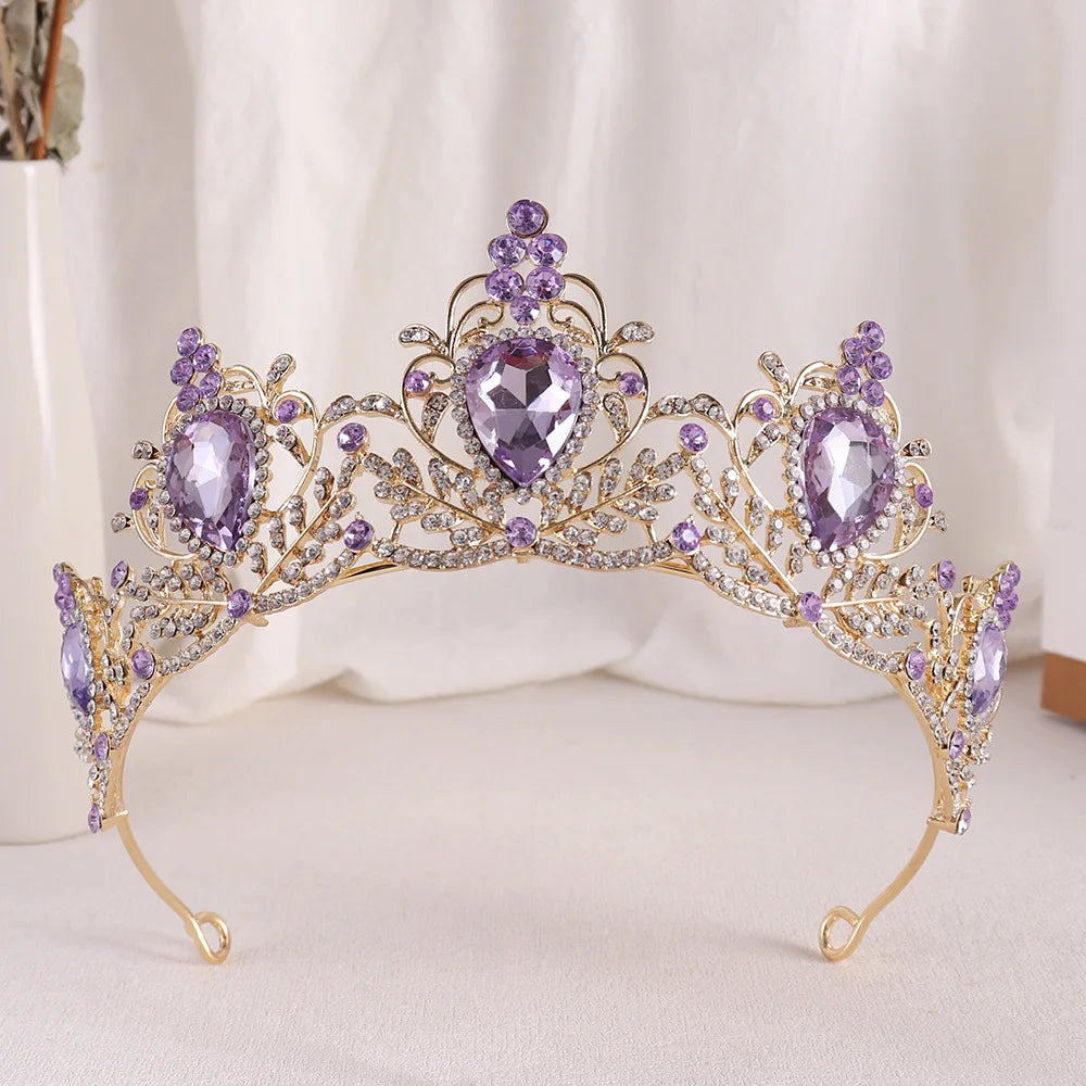 Gold bridal tiara with purple rhinestone crown and faceted teardrop center stone