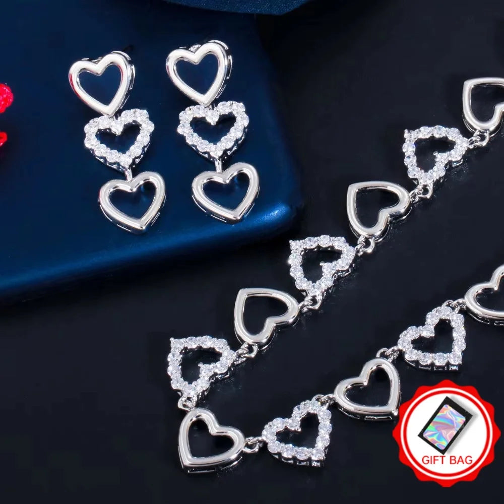 Silver heart necklace and matching drop earrings with clear cubic zirconia accents