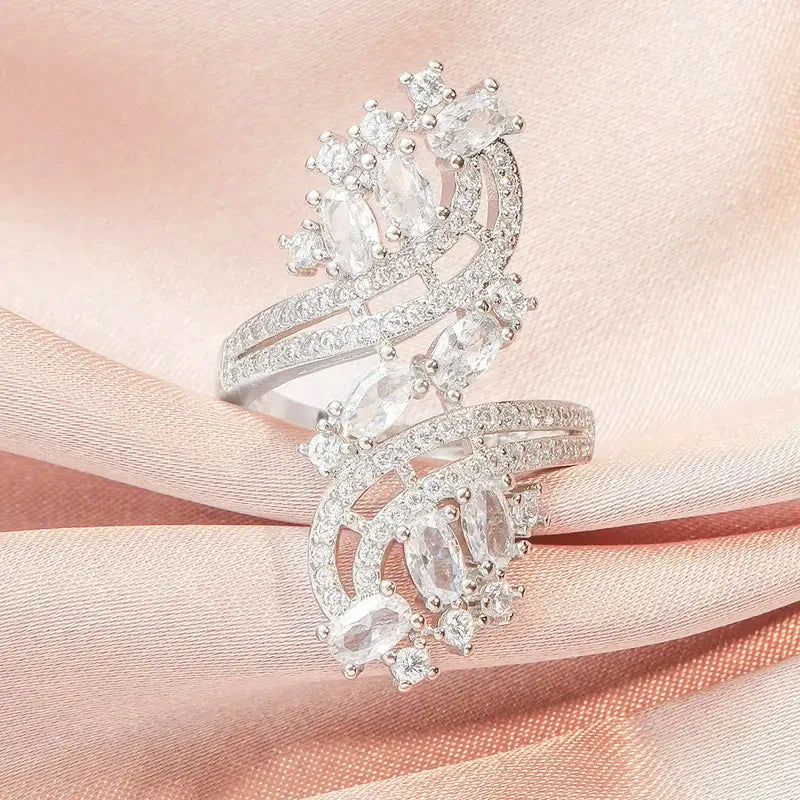 Rose-gold cubic zirconia bridal ring with clear oval stones and sparkling openwork halos