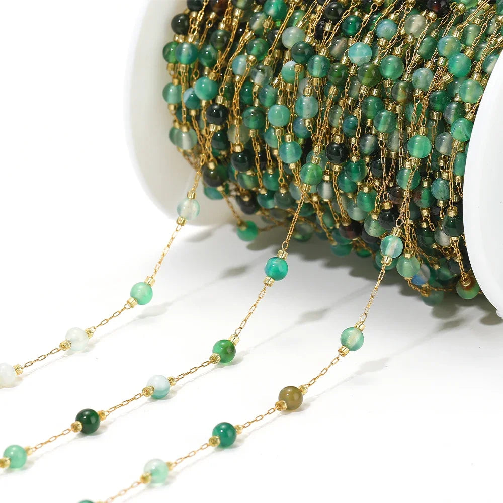 Turquoise gemstone bead chain with gold links, end strand shown for jewelry making