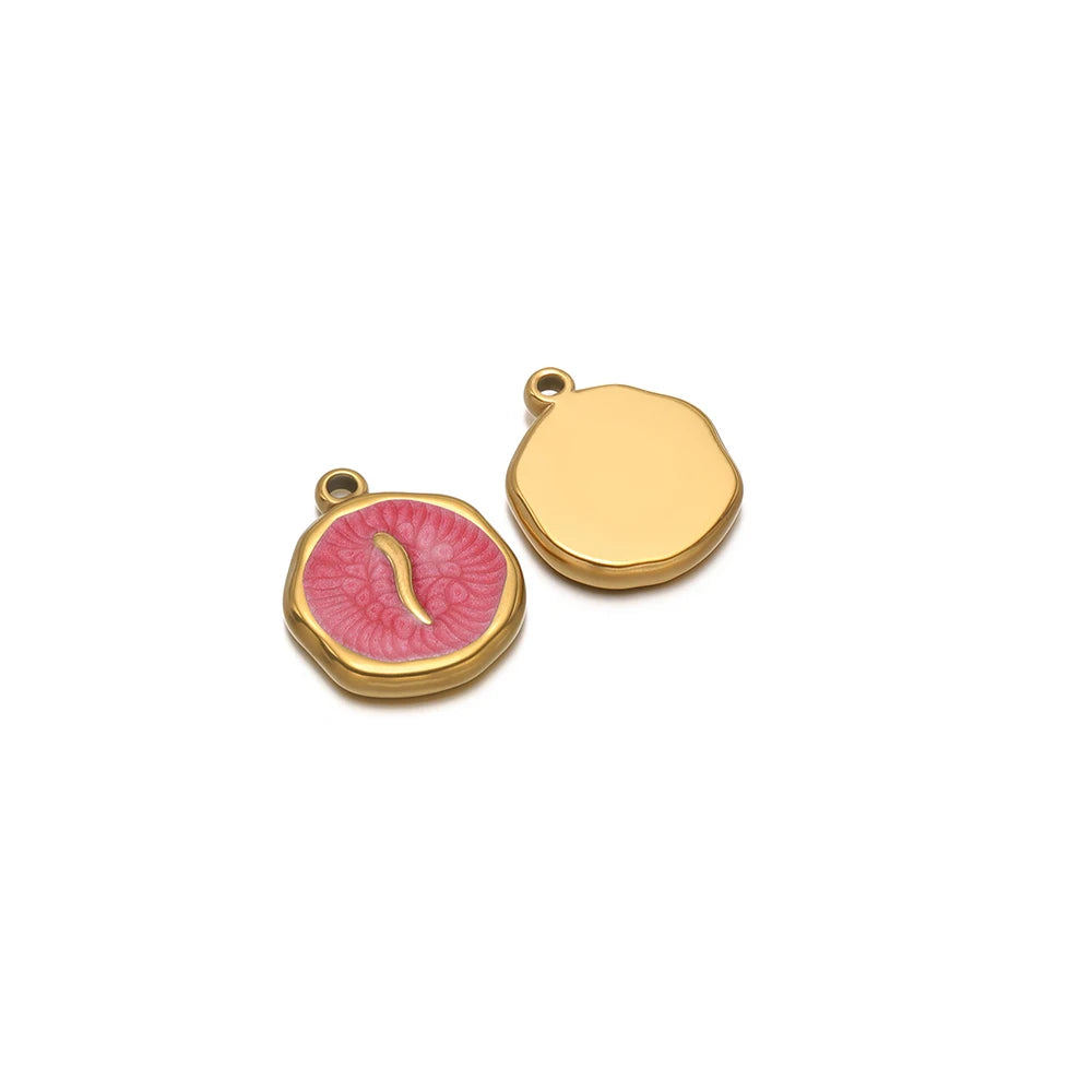 Gold-tone round charm with pink bird enamel, plus blank gold-tone round charm