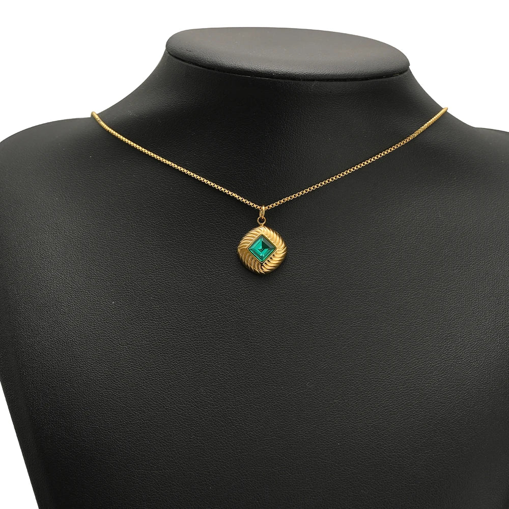 Gold-tone necklace charm with green square crystal pendant on thin chain
