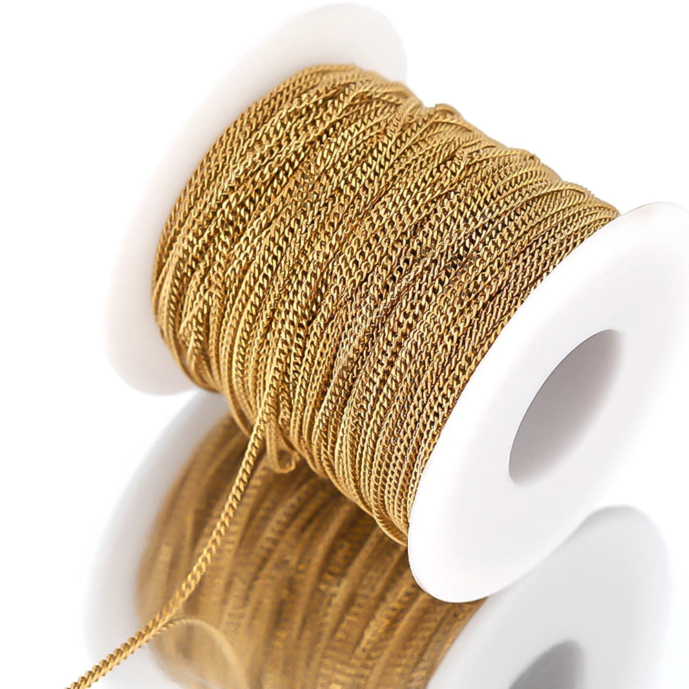 Gold curb Cuban link chain on spool, fine interlocking link pattern