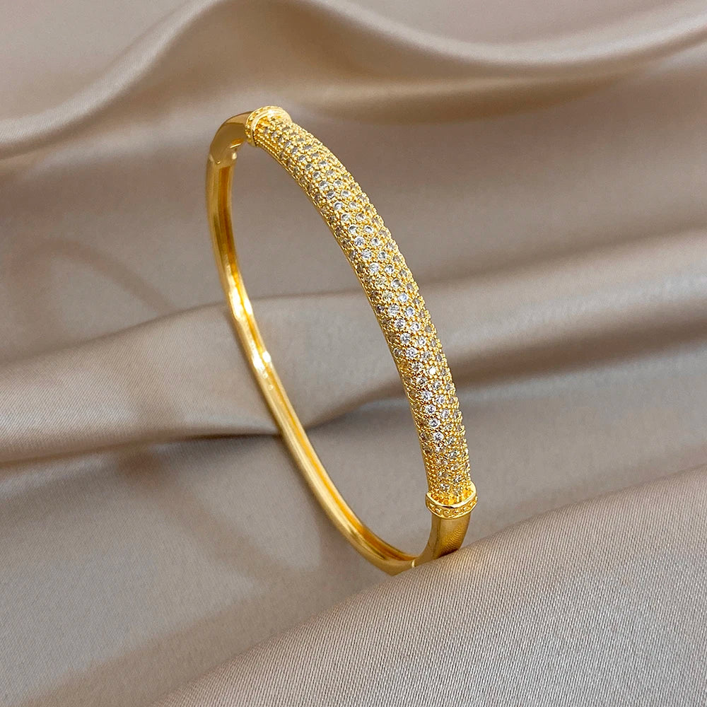 Gold-tone cuff bangle with pavé rhinestone detail