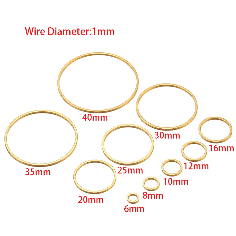 Gold-tone hollow circle bezel charms set with round wire rings in multiple sizes
