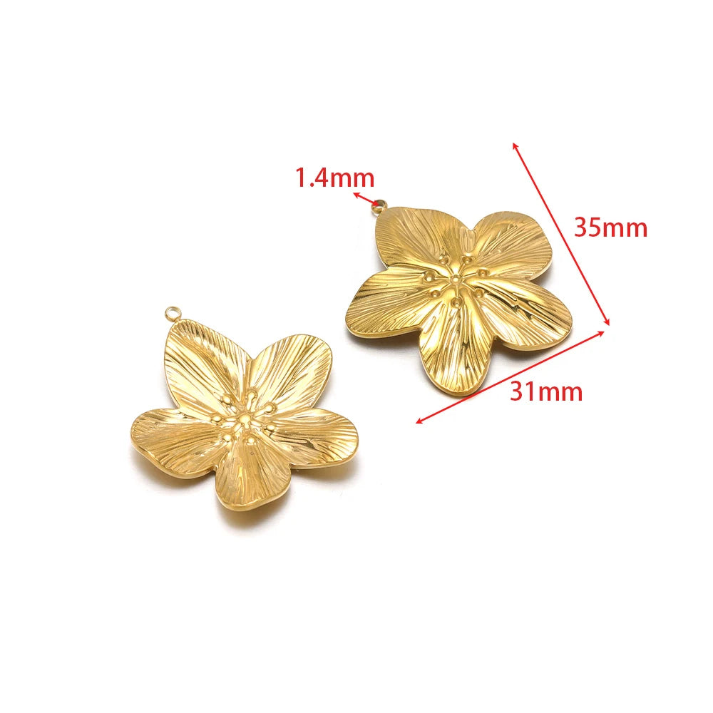 Gold flower/starfish charm pendant with embossed petals and hanging loop