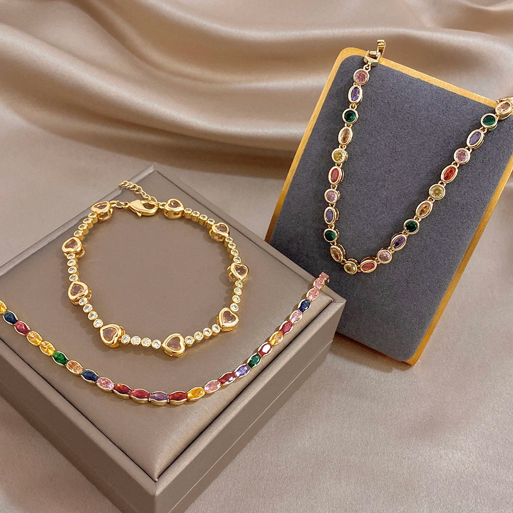 Gold-plated chain bracelet with multicolor zircon bead links and clasp closure