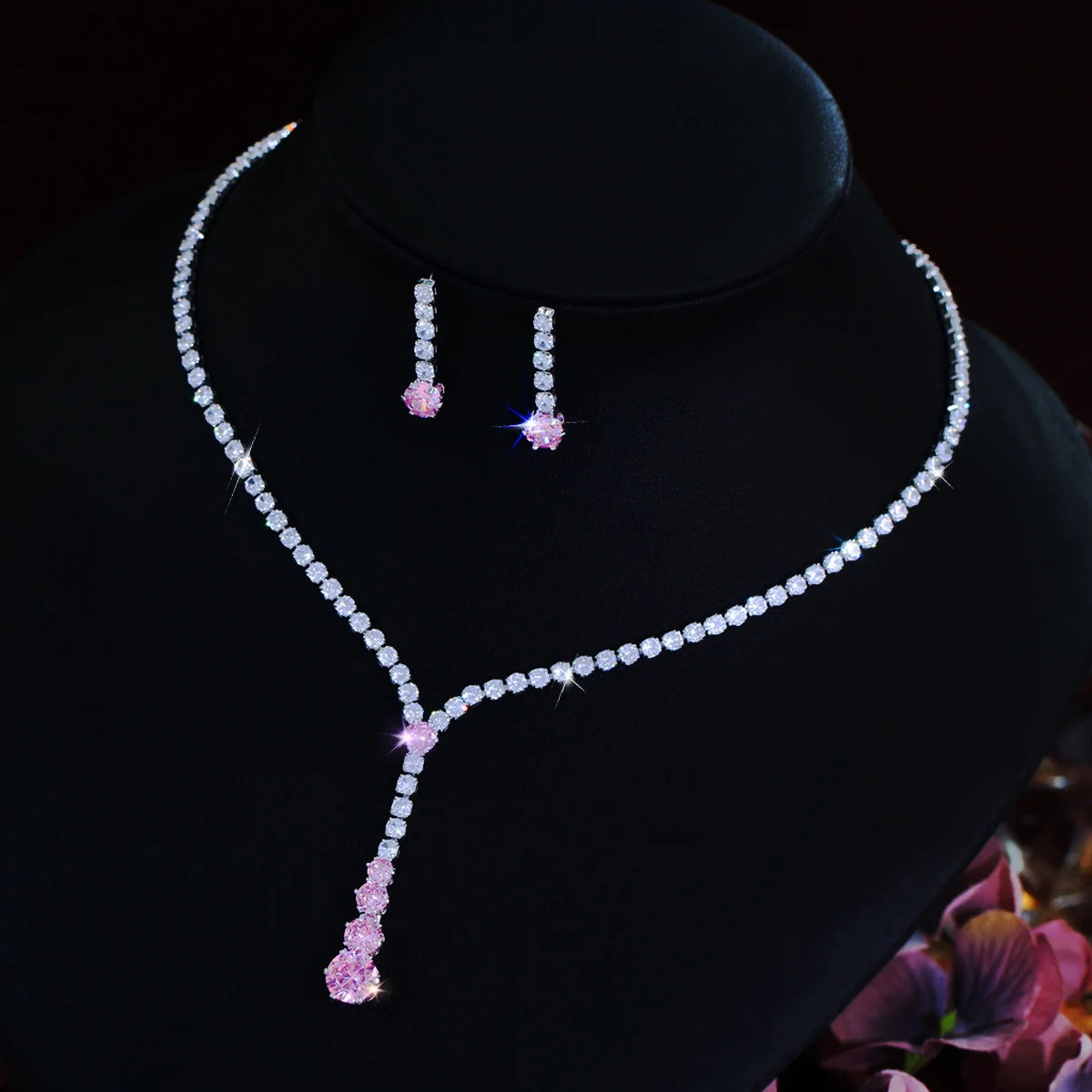 Y-shaped cubic zirconia necklace with pink drop pendant and matching earrings