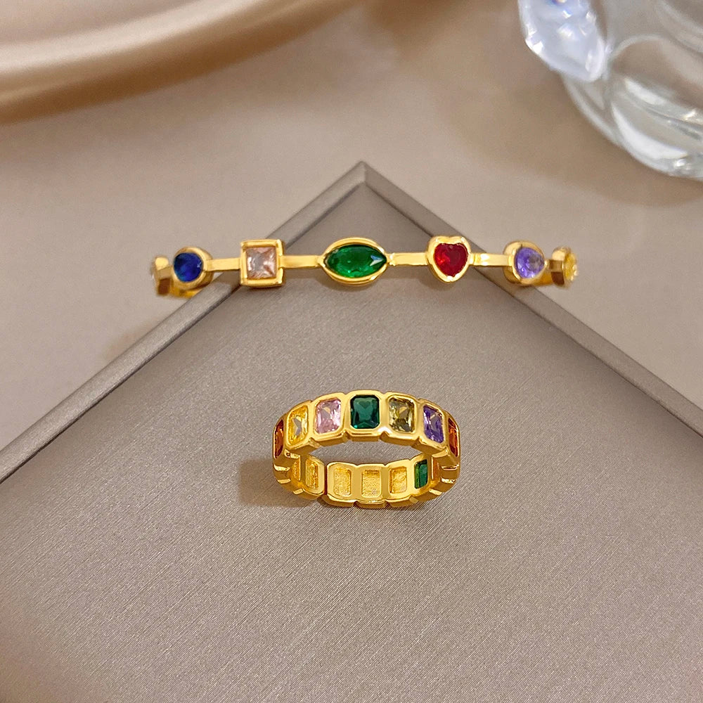Gold-tone multi-stone bangle bracelet and matching band ring with colorful gems