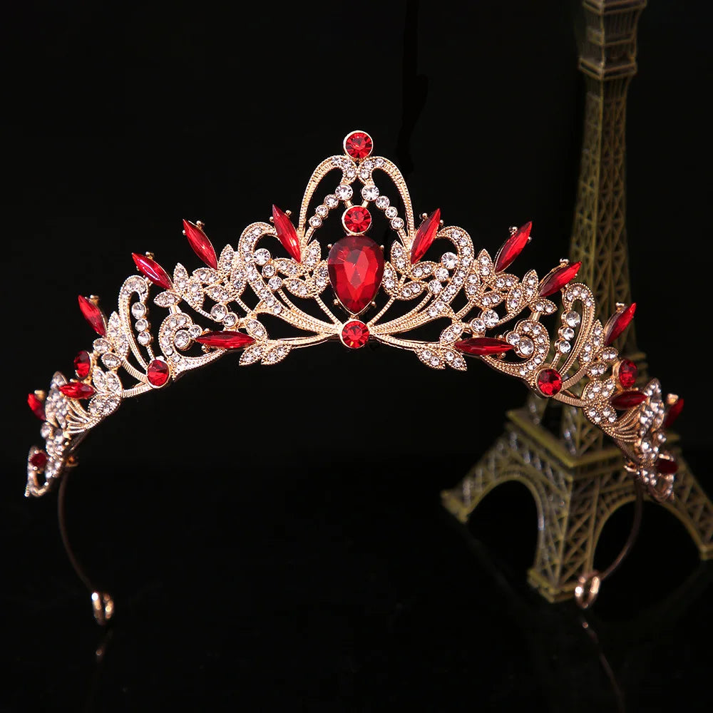 Jeweled bridal tiara crown with red and pink oval gemstones, silver-toned leaf design