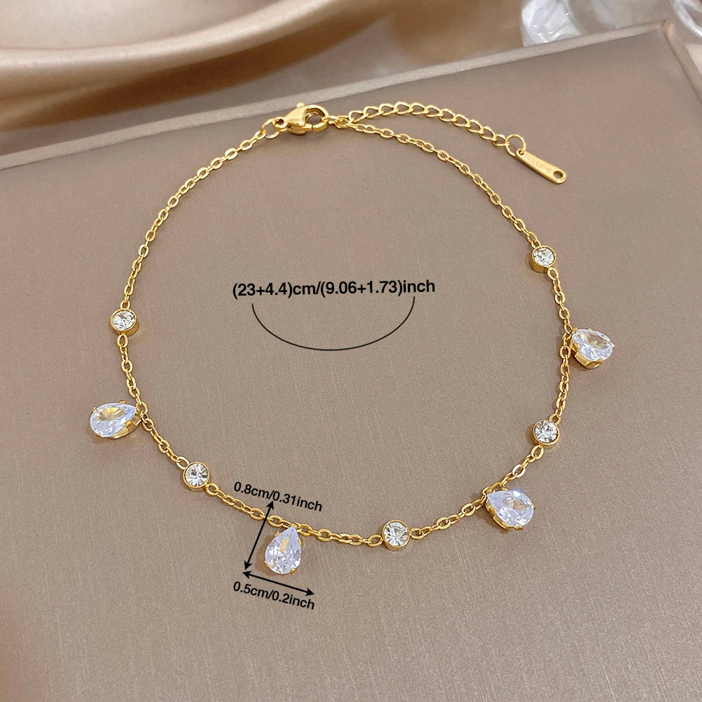 Gold-tone teardrop zircon link bracelet with toggle clasp and hanging stones