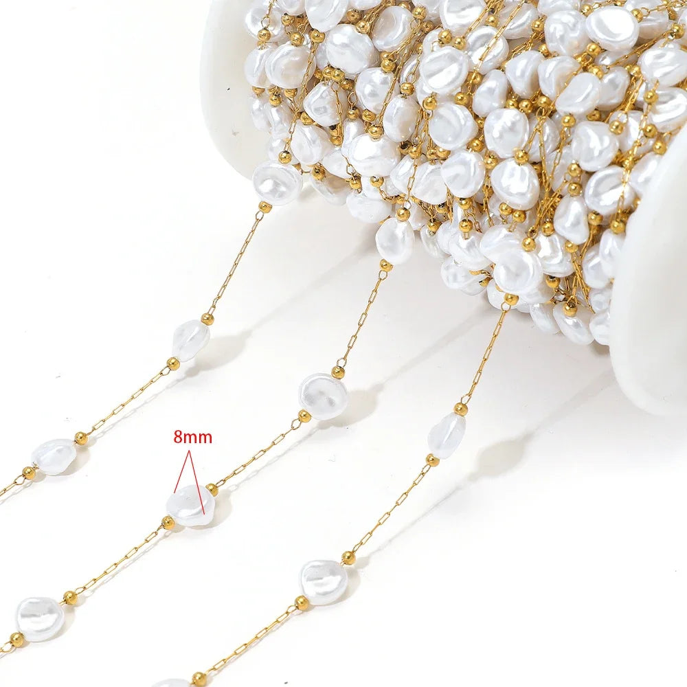 Artificial pearl chain with gold links and 8mm white oval beads