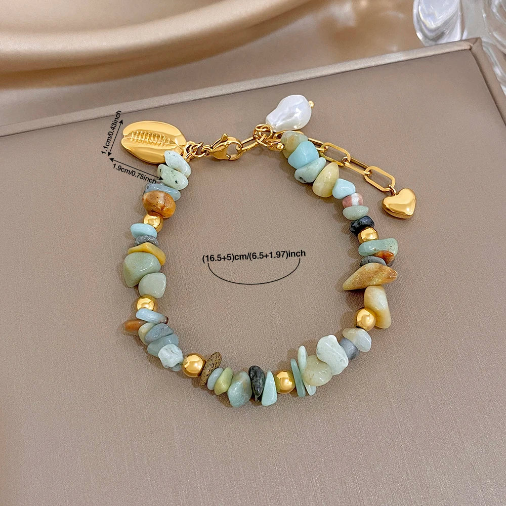 Beaded bracelet on gold chain with pale blue and cream irregular stones and heart charm clasp