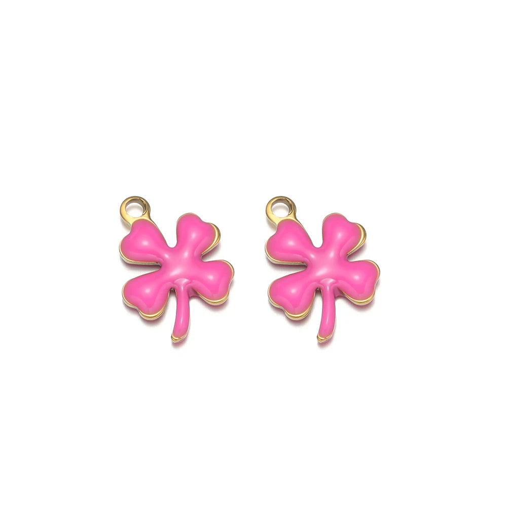 Hot pink enamel clover flower charms with gold-tone loops, pair view