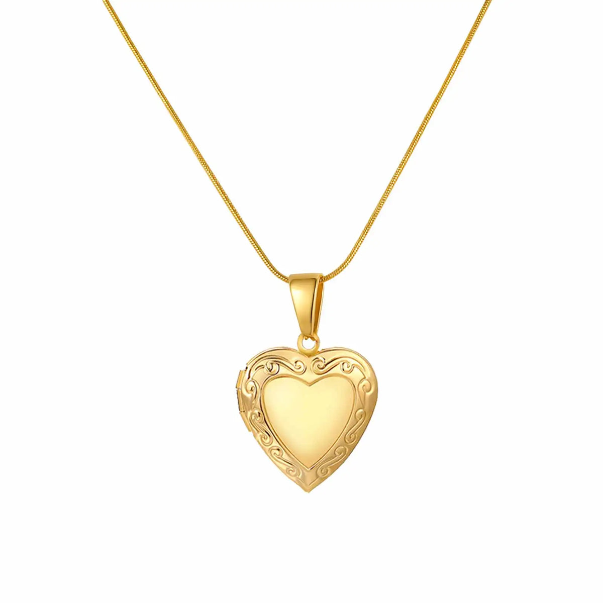 Gold heart pendant necklace with ornate heart charm on thin chain