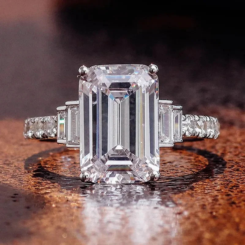 Silver-toned rectangular-cut zirconia engagement ring with baguette side stones