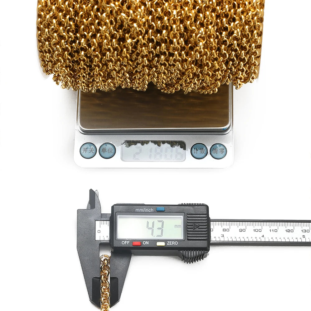 Gold Cuban link chain roll with digital caliper measuring the chain thickness