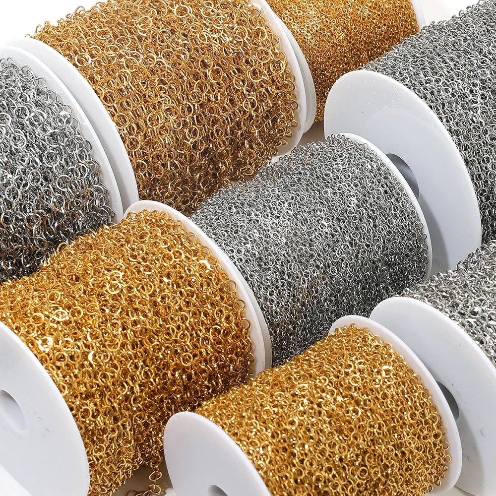Gold and silver o-ring link chain on white spools