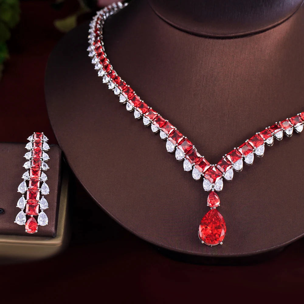 Close-up of red and clear cubic zirconia necklace pendant and matching drop earring