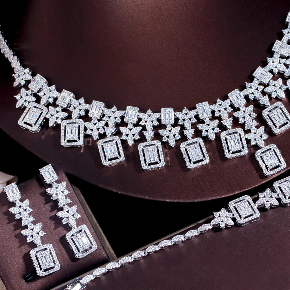 Crystal-like rhinestone necklace with geometric square and star motifs, silver-toned
