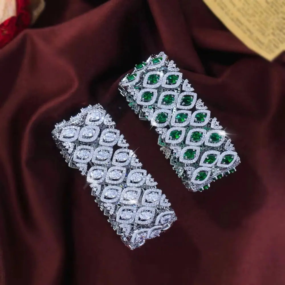 Wide multi-row bracelet with green or clear zirconia stones, shown from above