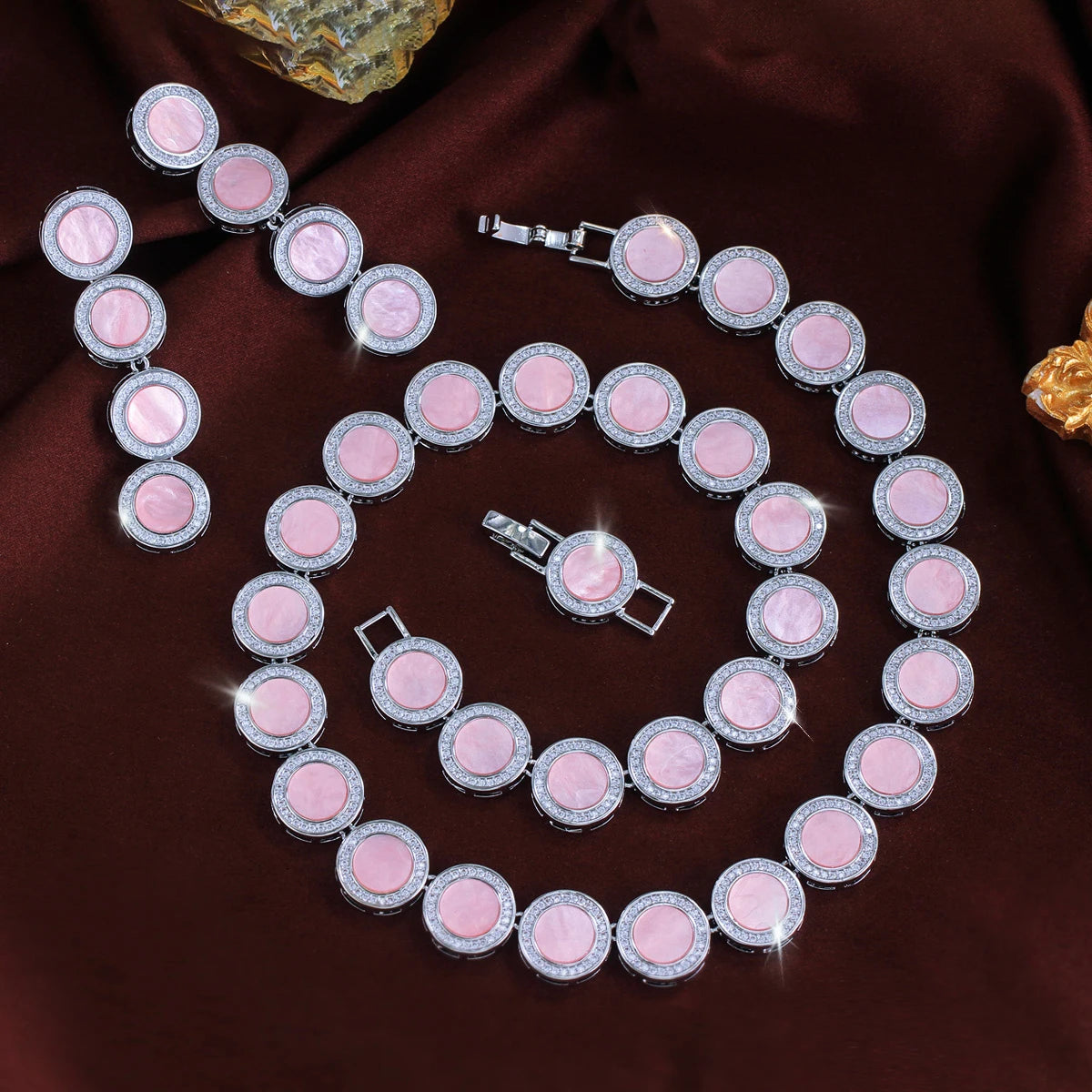 Pink oval link necklace with matching drop earrings and bracelet, silver-tone settings