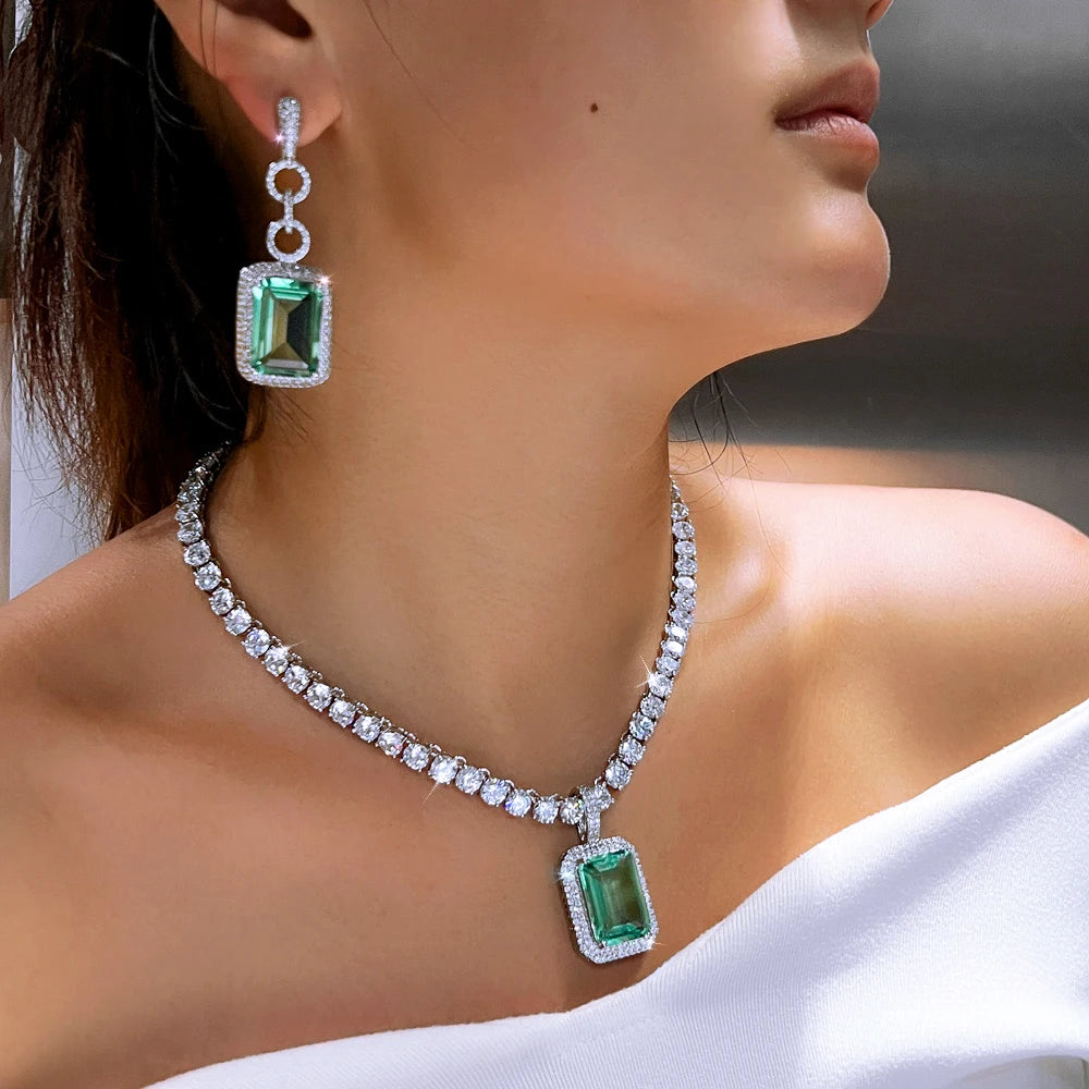 Teal cubic zirconia pendant necklace with matching drop earrings, silver-tone