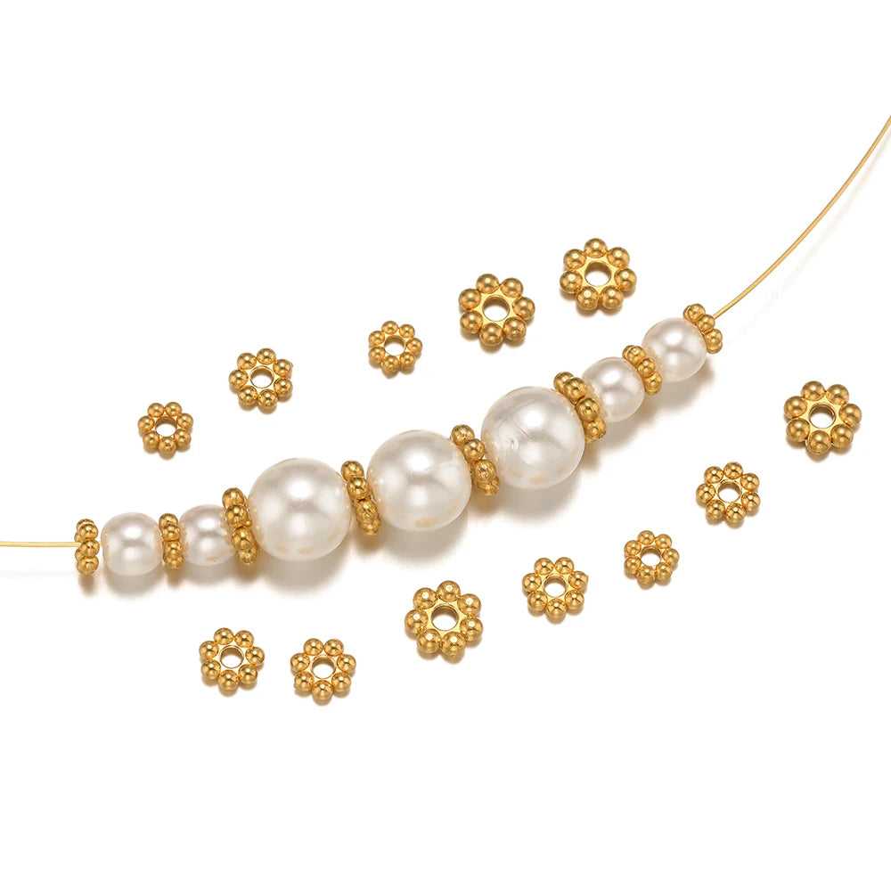 Gold flower spacer beads and pearl beads on a strand for bracelet necklace DIY.