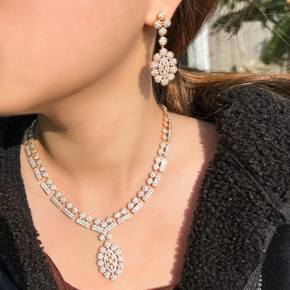 Gold-tone zirconia bridal necklace with teardrop pendant and matching drop earrings