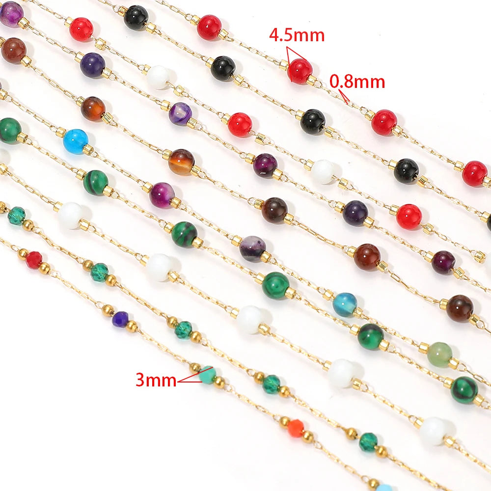 Thin gold-tone bead chain with small round gemstone beads in assorted colors