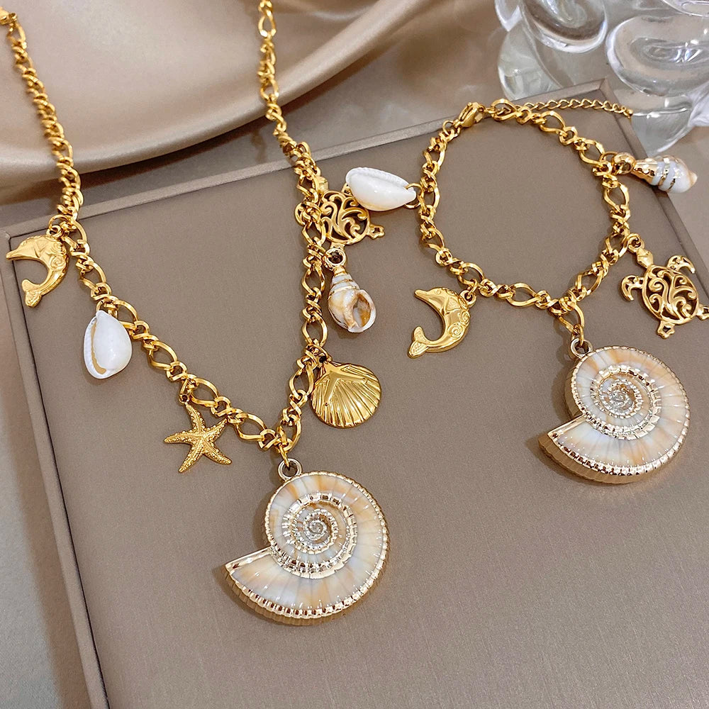 Gold-tone charm necklace and bracelet set with shell fan pendant and starfish charms