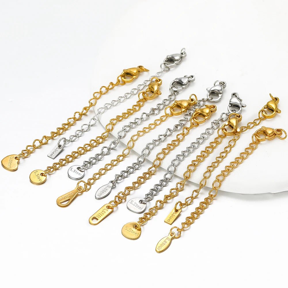 Assorted gold and silver lobster clasp extension tail chains with engraved end tags