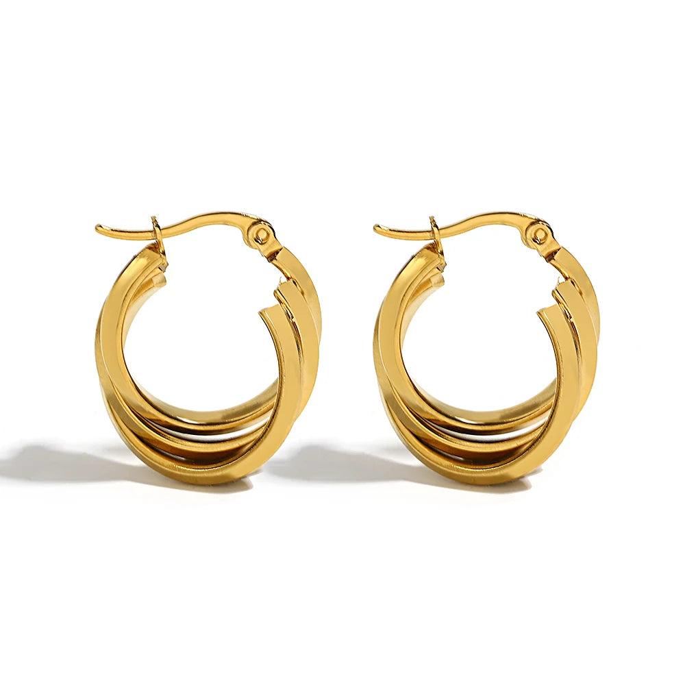 Gold-tone chunky hoop earrings with layered, smooth curved bands