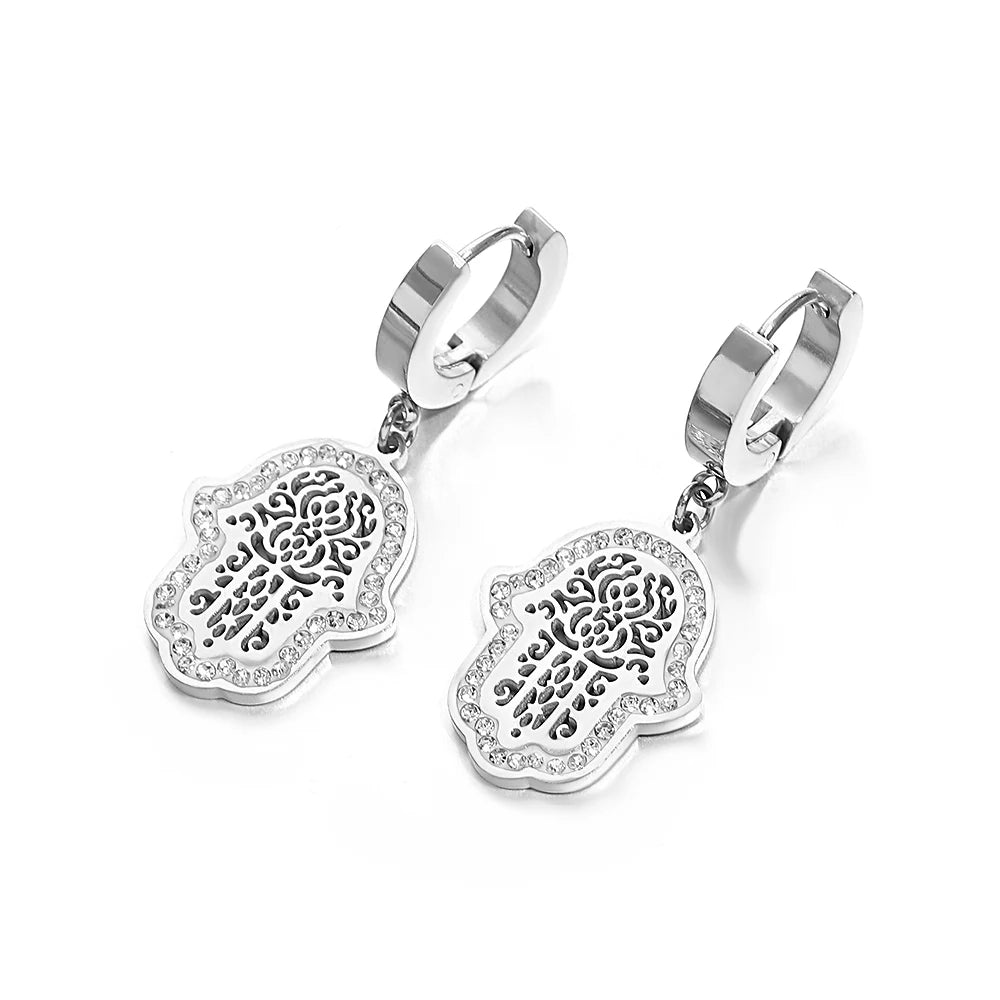 Pair of silver-tone hoop earrings with crystal-edged hamsa filigree charms