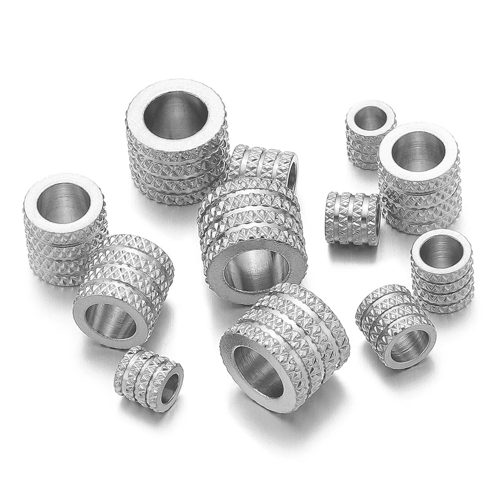Silver-tone large-hole spacer beads with textured diamond pattern and open center hole