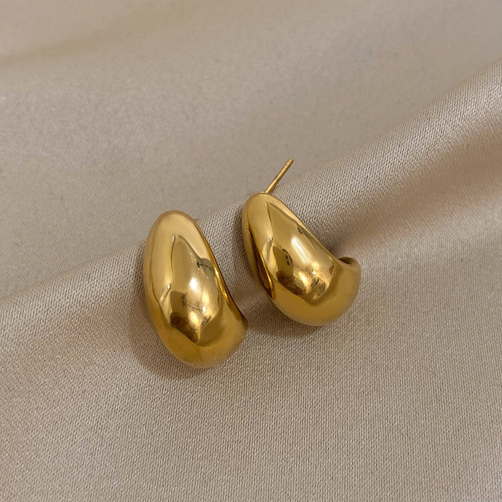 Pair of polished gold-tone oval dome stud earrings