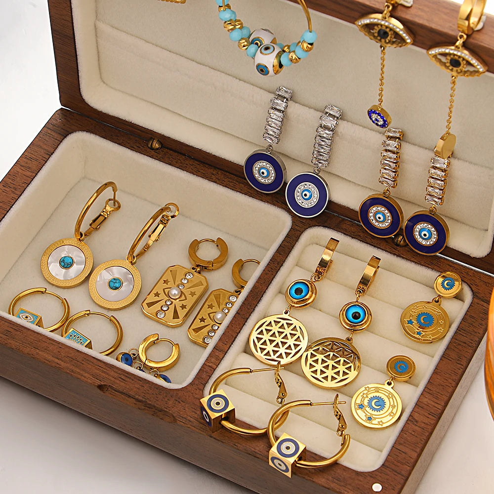 Gold-tone evil eye earrings in assorted hoop and drop styles