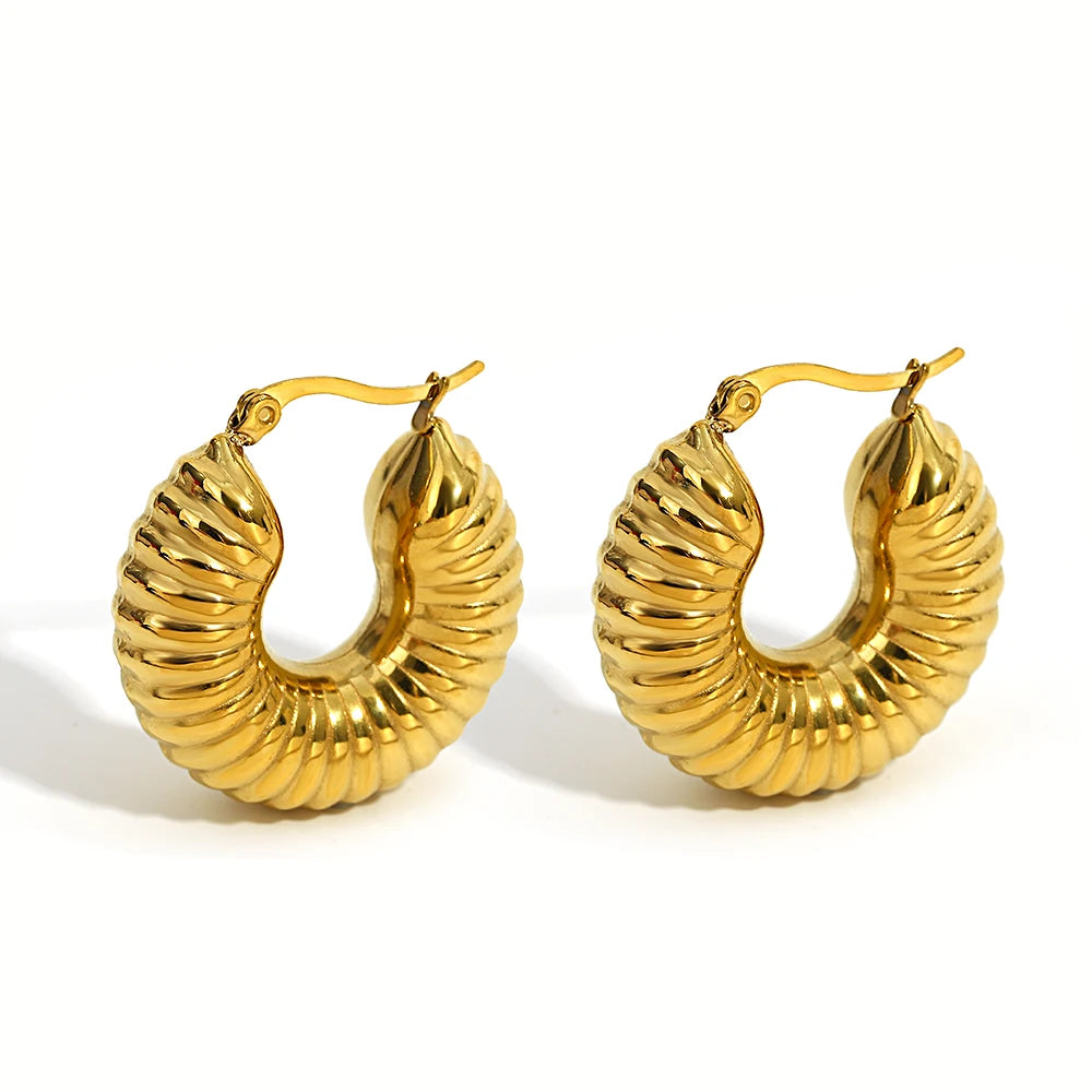 Gold-tone chunky hoop earrings with ridged, domed half-circle fronts