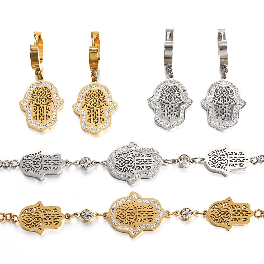 Gold- and silver-tone hamsa hoop earrings and bracelets with intricate filigree charms