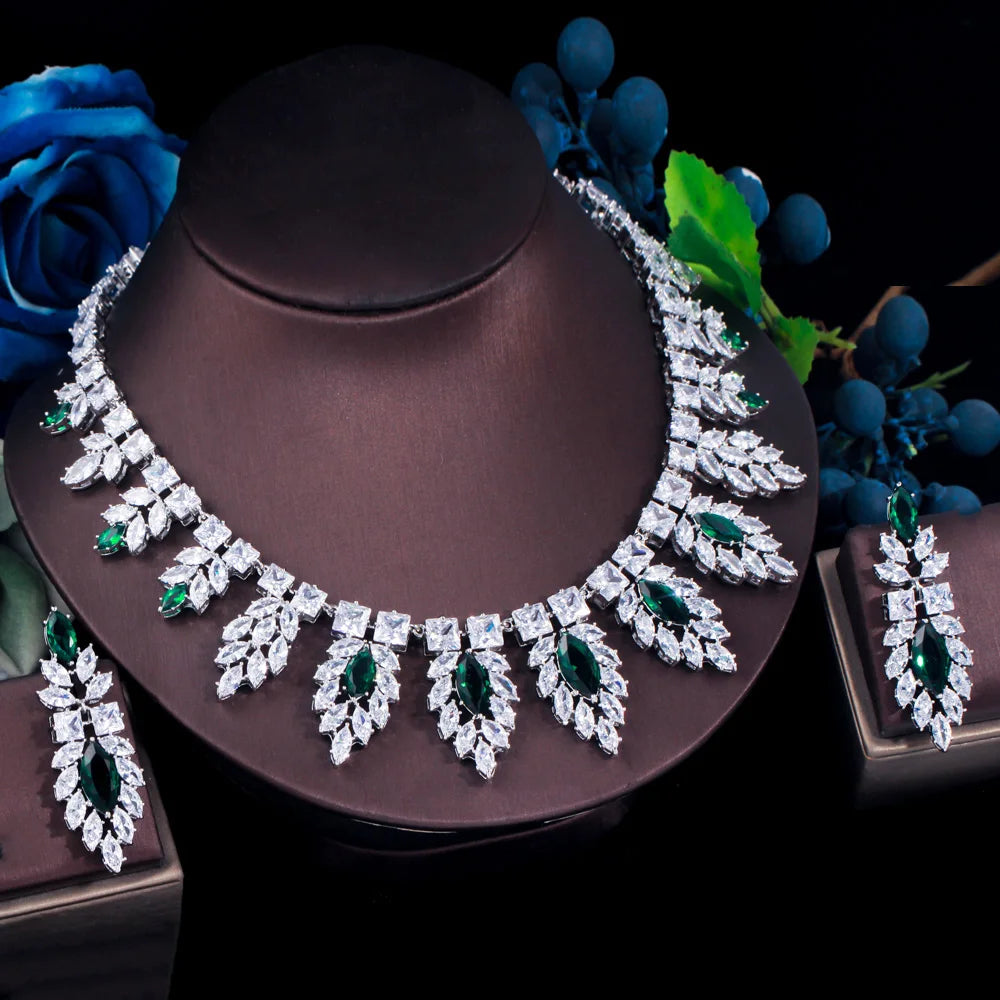 Silver-tone bridal necklace with green leaf accents and matching green teardrop drop earrings