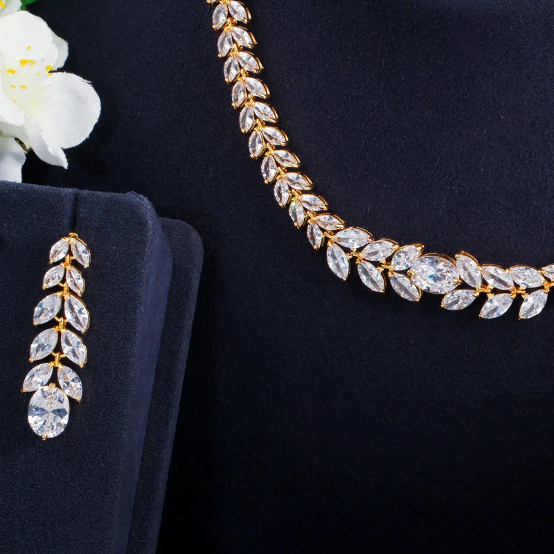 Gold-tone necklace and matching drop earring with clear leaf-shaped stones