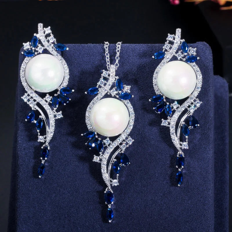 White imitation pearl necklace and earrings with blue zirconia leaf accents