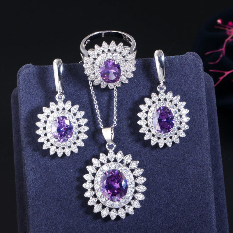 Purple oval cubic zirconia jewelry set with flower-halo earrings, pendant necklace, and ring
